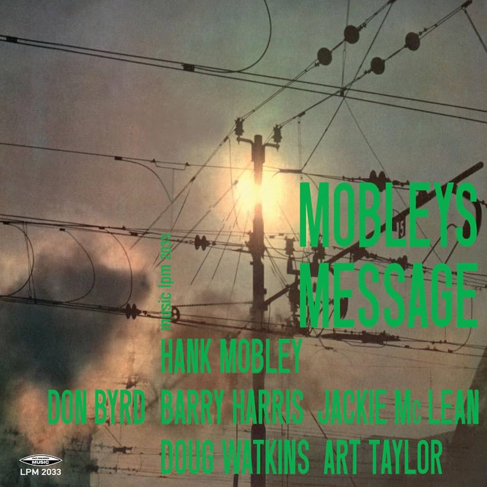 Copertina Hank Mobley Mobley's Message Hi-Fi Records Music - palo della luce con fili elettrici su cielo nuvoloso al tramonto, testo verde con nomi Hank Mobley Don Byrd Barry Harris Jackie McLean Doug Watkins Art Taylor, logo Music LPM 2033 in basso a sinistra